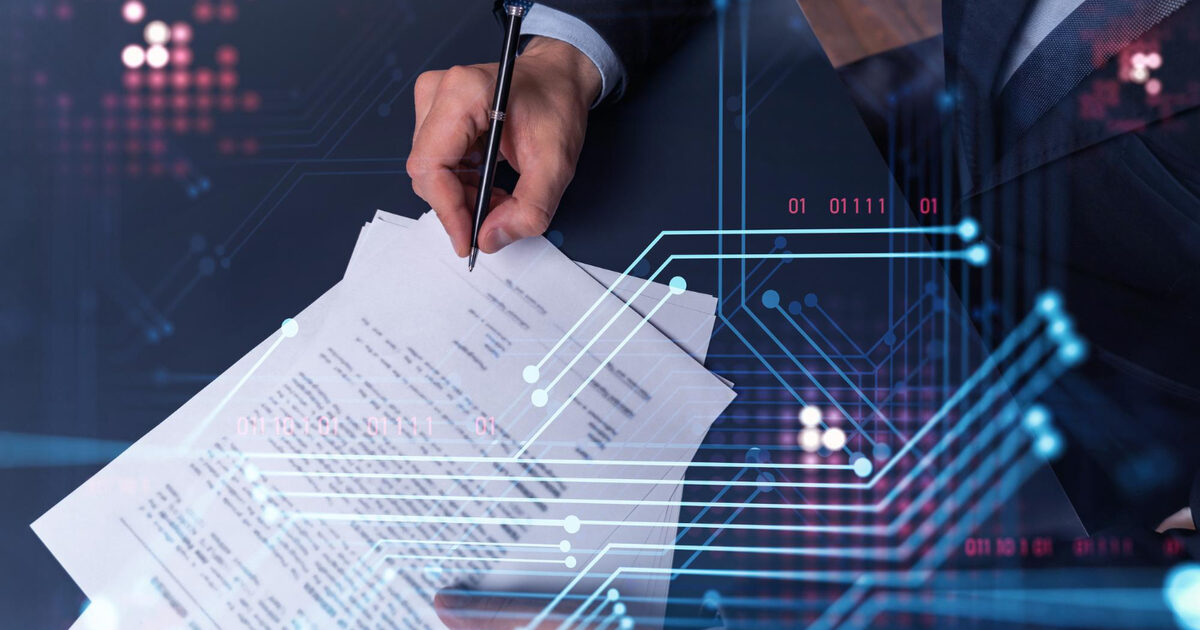Hand signing a contract with a digital circuit overlay representing a data processing agreement