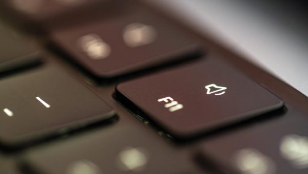 Close-up laptop F11 keyboard key symbolizing browser opt-out signals like Global Privacy Control and Do Not Track