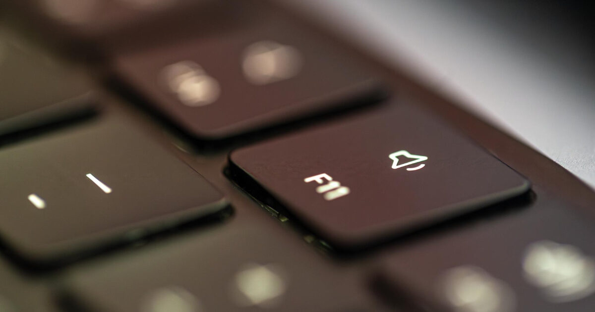 Close-up laptop F11 keyboard key symbolizing browser opt-out signals like Global Privacy Control and Do Not Track